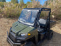 Polaris Ranger SP570 / Mid‑Size laminated glass windshield with metal frame and manual wiper